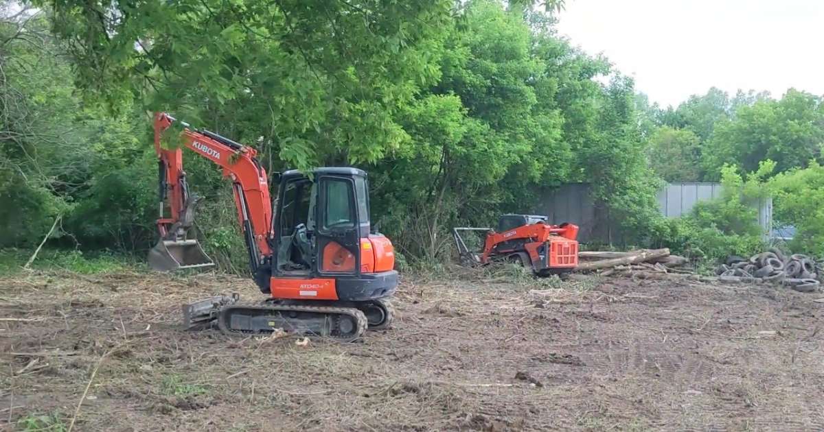 a tractor and a bulldozer in a field